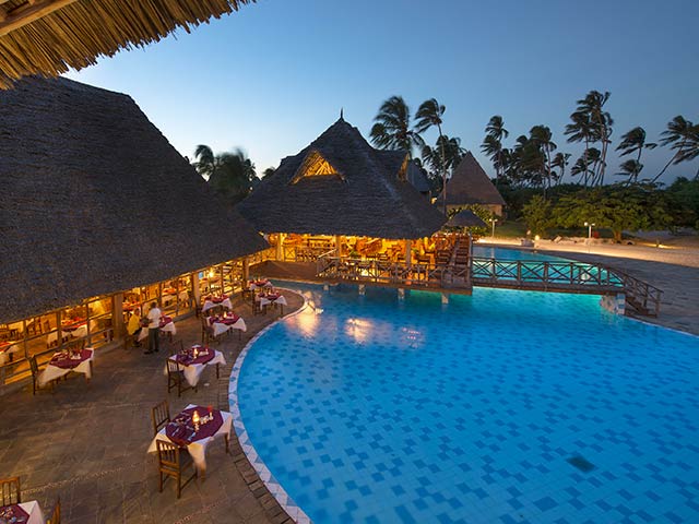 Neptune Pwani Main Restaurant Evening Pool View Gallery.